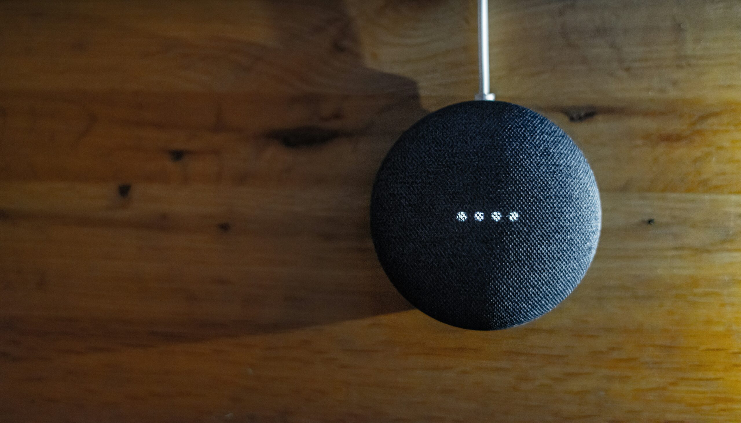 Smart Home Security blue ball on a wooden surface