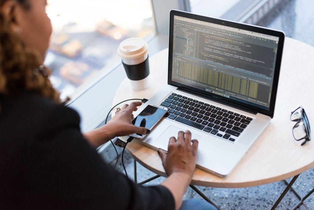 Administrator Access: 7 Simple Steps to Take It Back 3 Laptop open on a round wooden table in an office