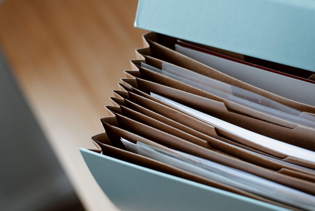 Cloud Subscription Exit: 7 Proven Steps to Keep Your Data 3 Open folder of business records on a desk